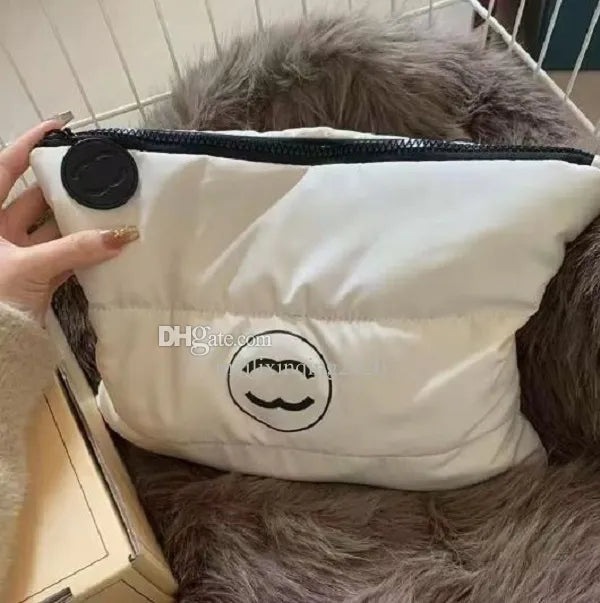 Premium cosmetic pouch set displayed in neutral beige color