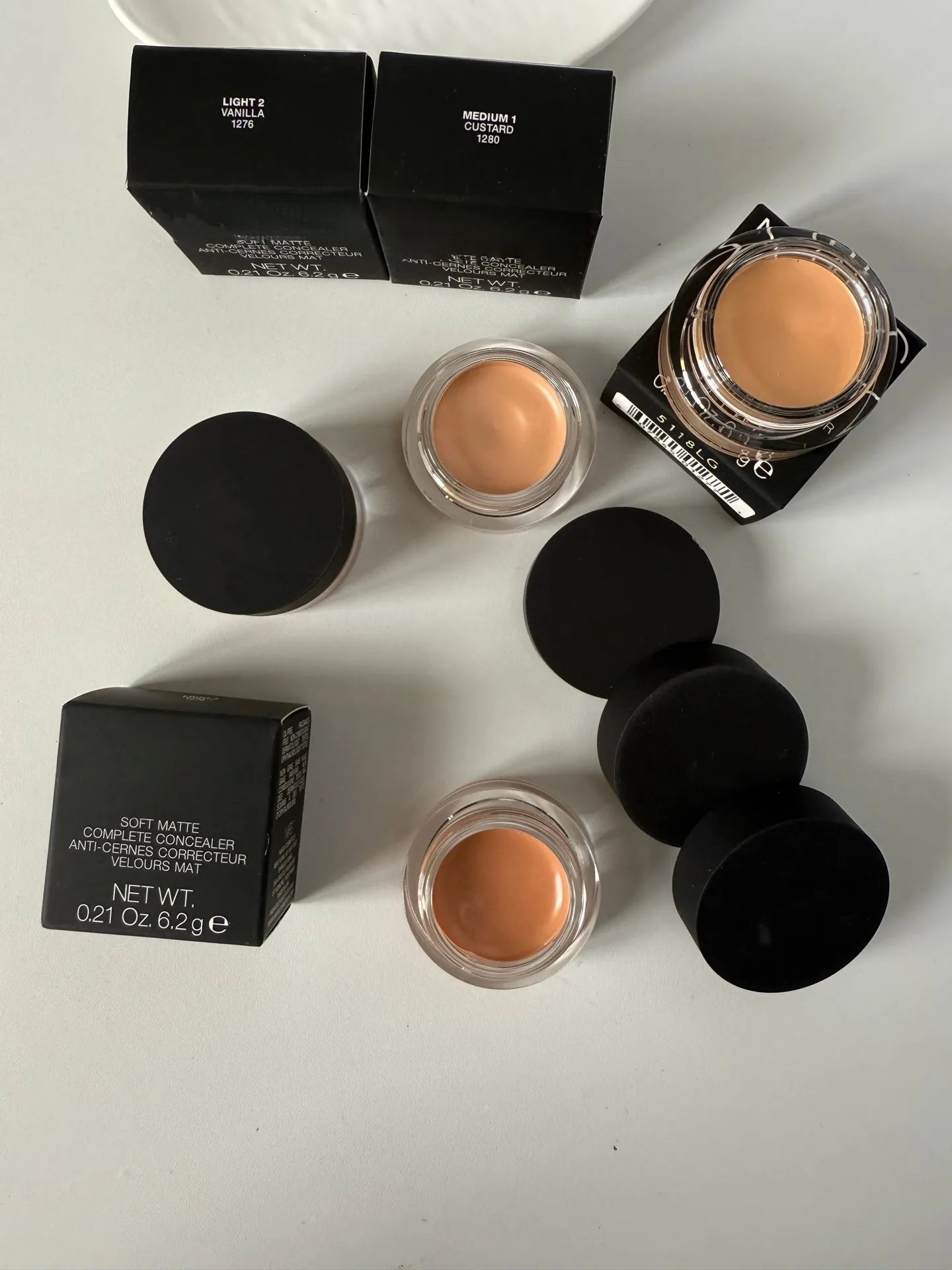 Matte finish concealer cream in a compact container