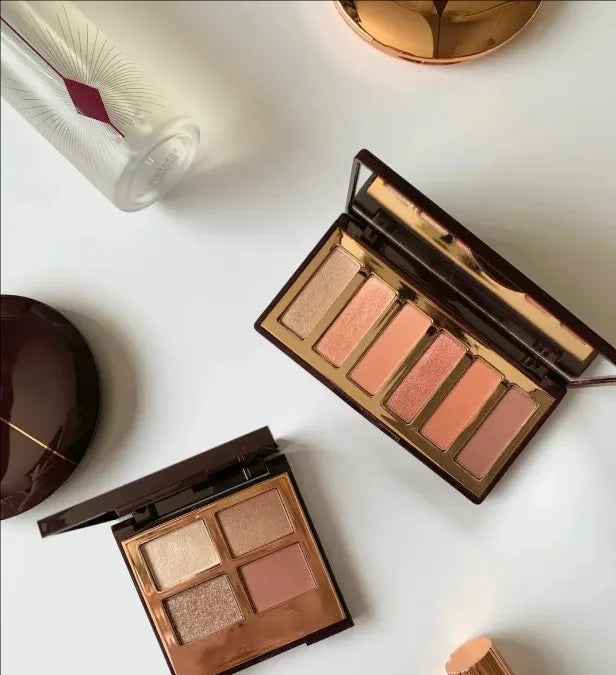 Swatch demonstration of matte and shimmer eyeshadow colors on skin