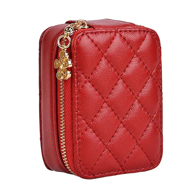 Open leather makeup bag revealing interior compartment and built-in mirror