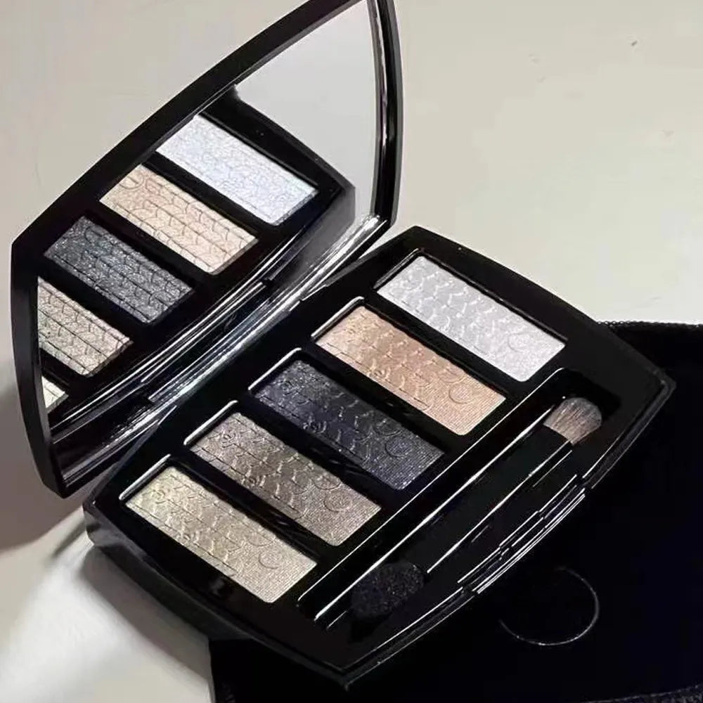 Five-color eyeshadow palette showing glitter and pearly finishes