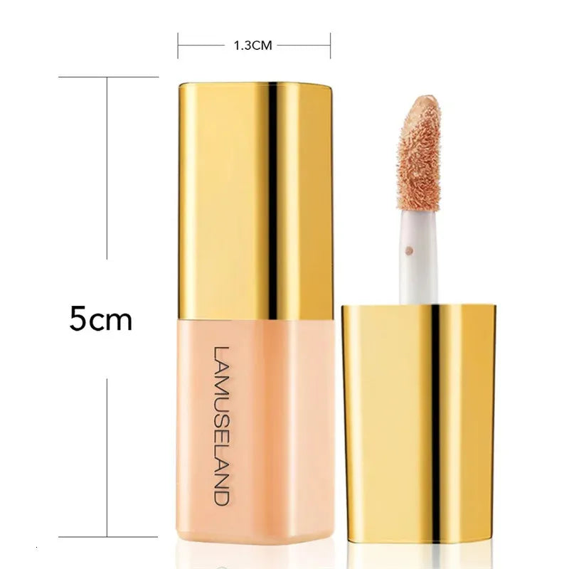 Makeup brush blending color-correcting concealer on skin surface
