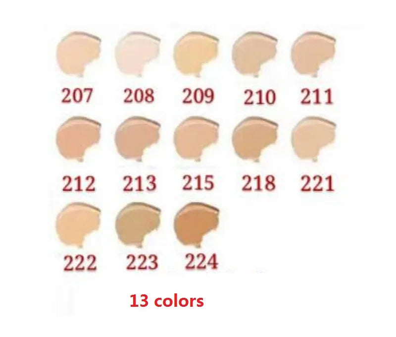 Foundation bottle alongside makeup brush and sponge for application demonstration