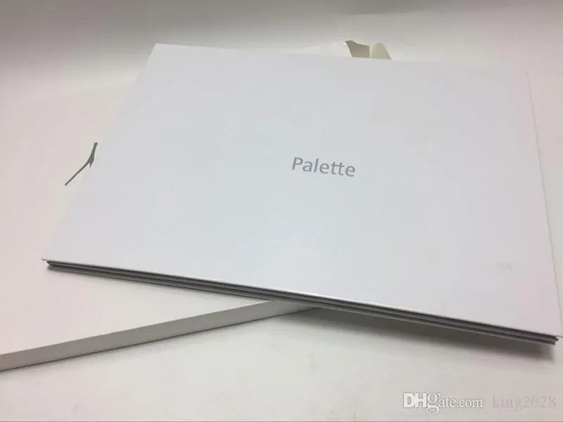 Close-up of eyeshadow palette with swatches of matte colors
