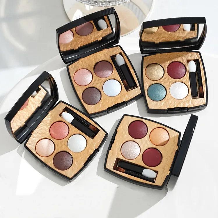 Close-up view of eyeshadow palette with four complementary colors
