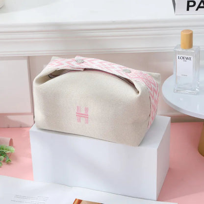 Interior view of cosmetics bag showing spacious compartment for toiletries