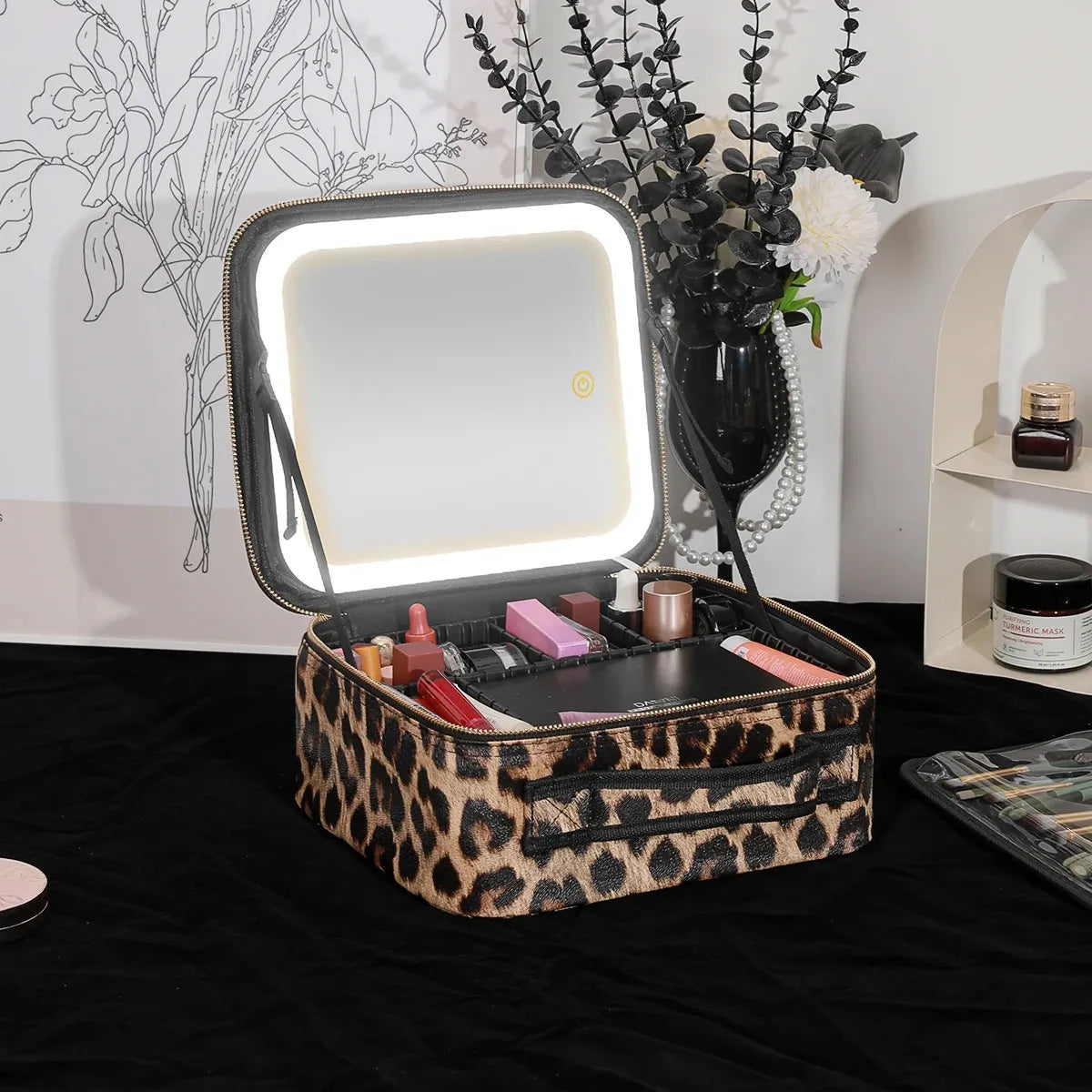 Close-up view of makeup bag with illuminated mirror and LED light settings