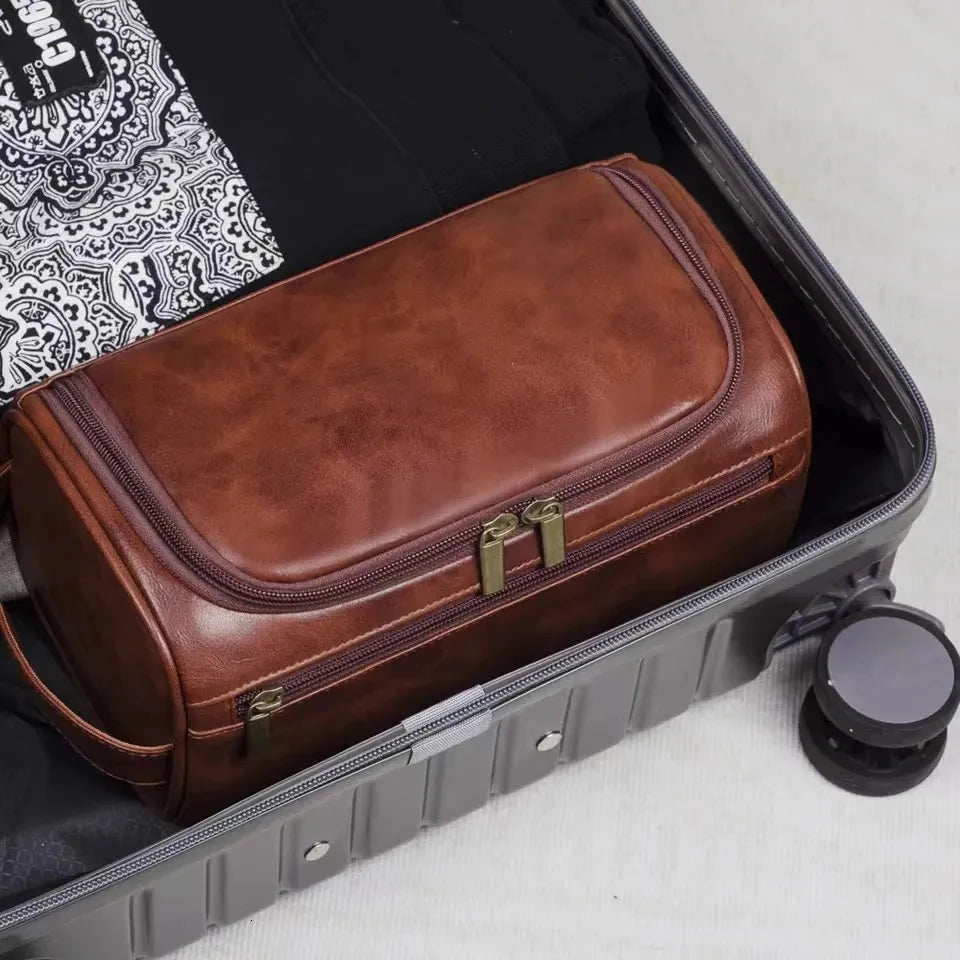 Close-up view of leather toiletry bag with hanging hook and zipper