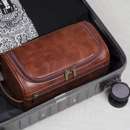 Close-up view of leather toiletry bag with hanging hook and zipper
