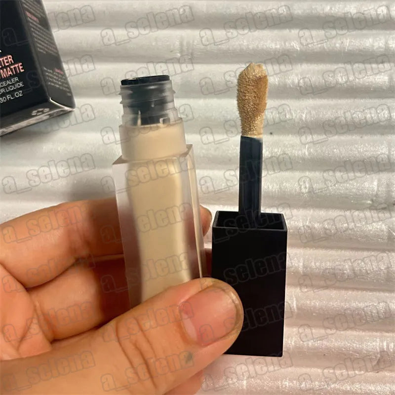 Close-up view of concealer being applied to hand to show texture