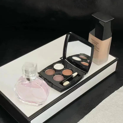 Makeup set with perfume and cosmetics displayed in an open box