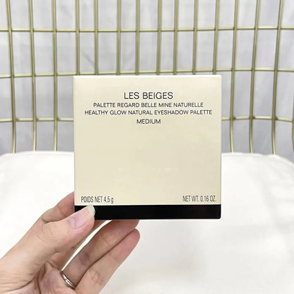 Close-up view of the eyeshadow palette showing smooth texture and color variety