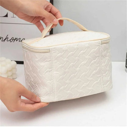 Side perspective of portable makeup bag showing handheld design