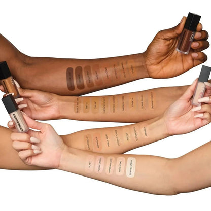 Liquid concealer product in clear container with applicator