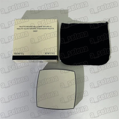 Eyeshadow palette with open lid and four matte shades arranged in a row