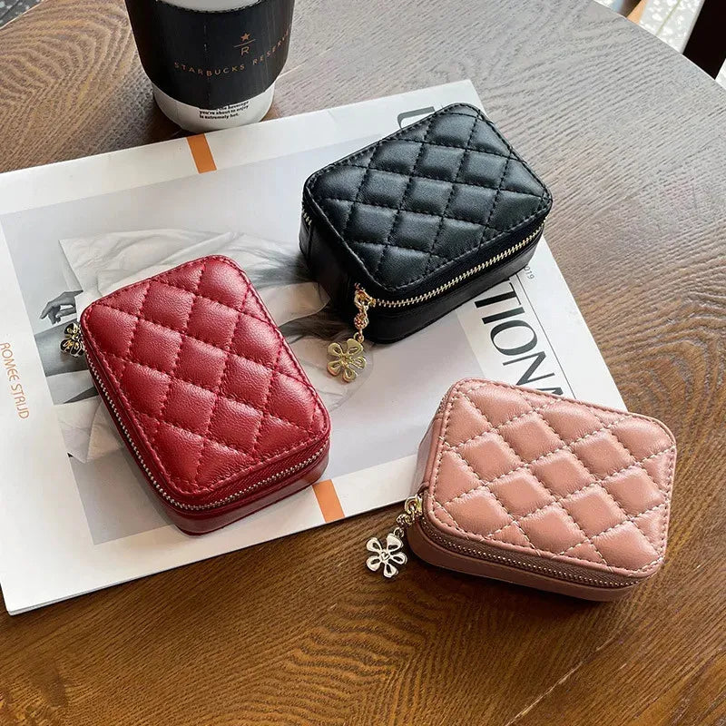 Open leather makeup bag revealing interior compartment and built-in mirror