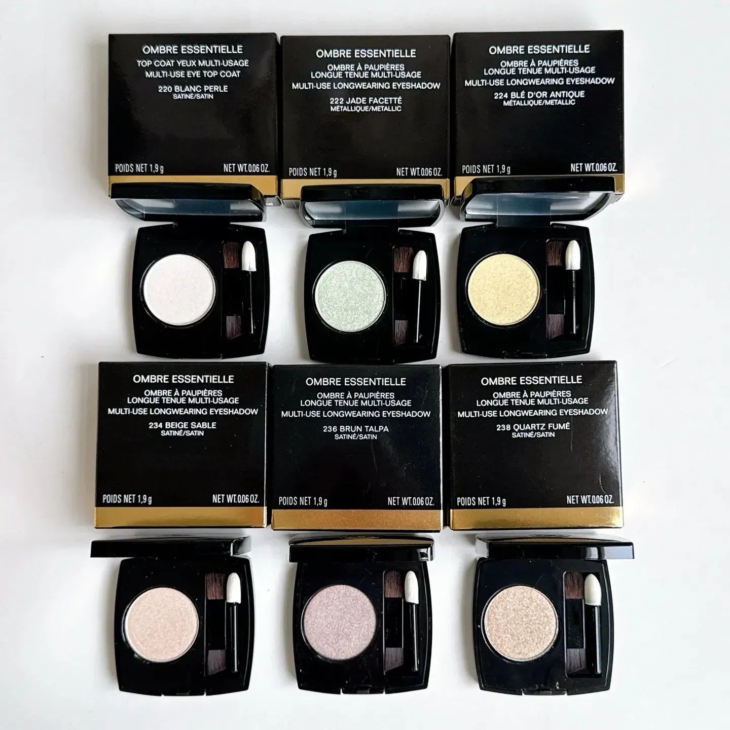 Swatch display of the six monochrome eye shadow colors on skin