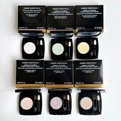 Swatch display of the six monochrome eye shadow colors on skin