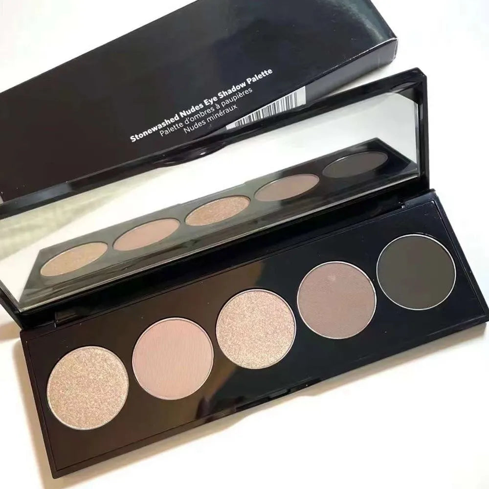 Close-up of eyeshadow palette showing shimmer and matte finishes