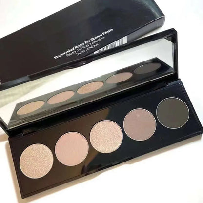 Close-up of eyeshadow palette showing shimmer and matte finishes