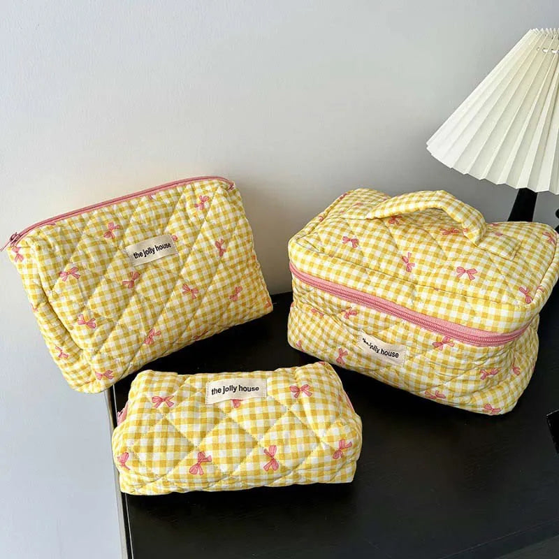 Open view showing interior space of large capacity makeup bag
