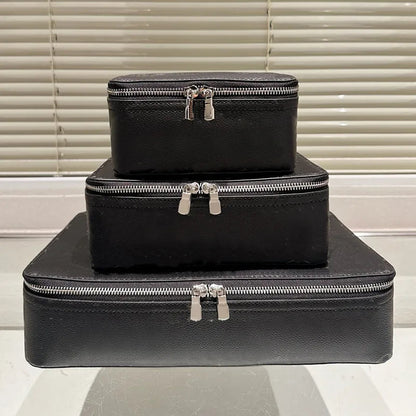 Multiple packing cubes organized in luggage with different color variations