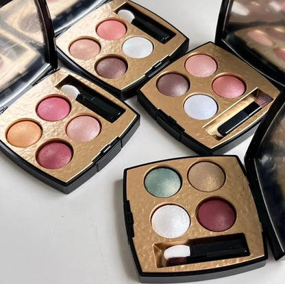 Close-up view of eyeshadow palette with four complementary shades