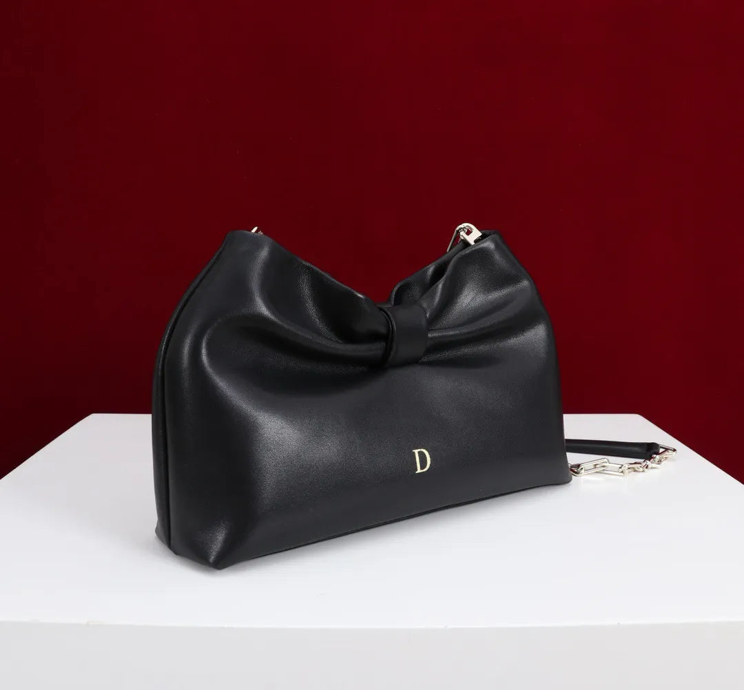 Interior view displaying organized compartments of women's handbag