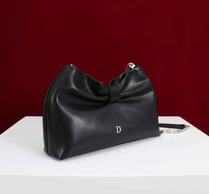 Interior view displaying organized compartments of women's handbag