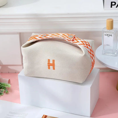 Canvas cosmetics bag with waterproof exterior in lavender color