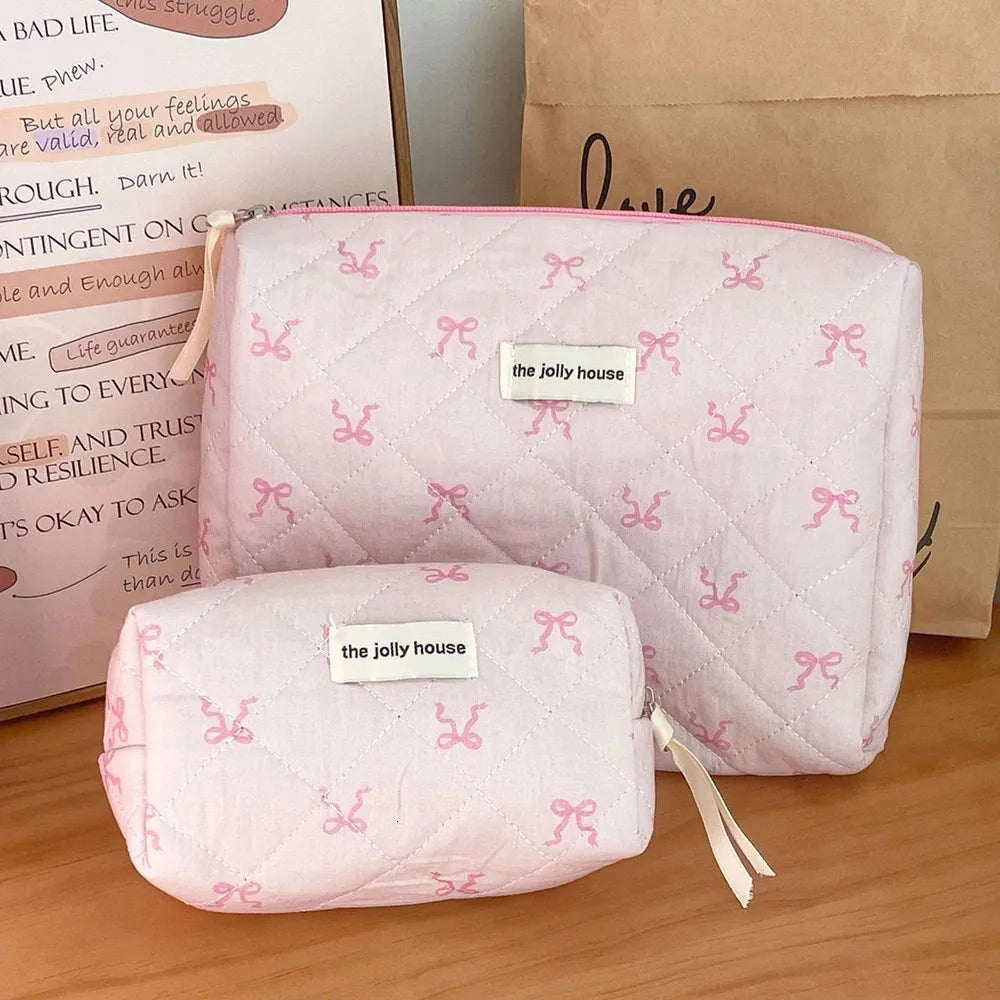 Open cosmetic bag showing interior compartments and zipper closure