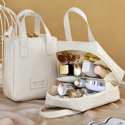 Open view of the cosmetic bag showing interior compartments and organization
