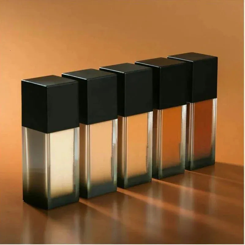 Matte liquid foundation and concealer bottle with applicator