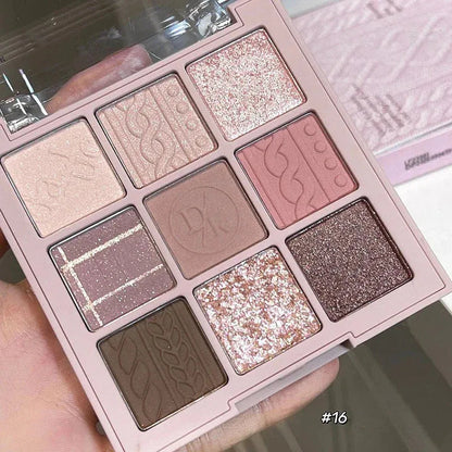 Open eyeshadow palette displaying nine different color pans