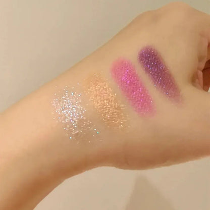 Makeup palette with brush demonstrating application on hand
