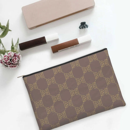 Cosmetic bag held in hand to display size and design