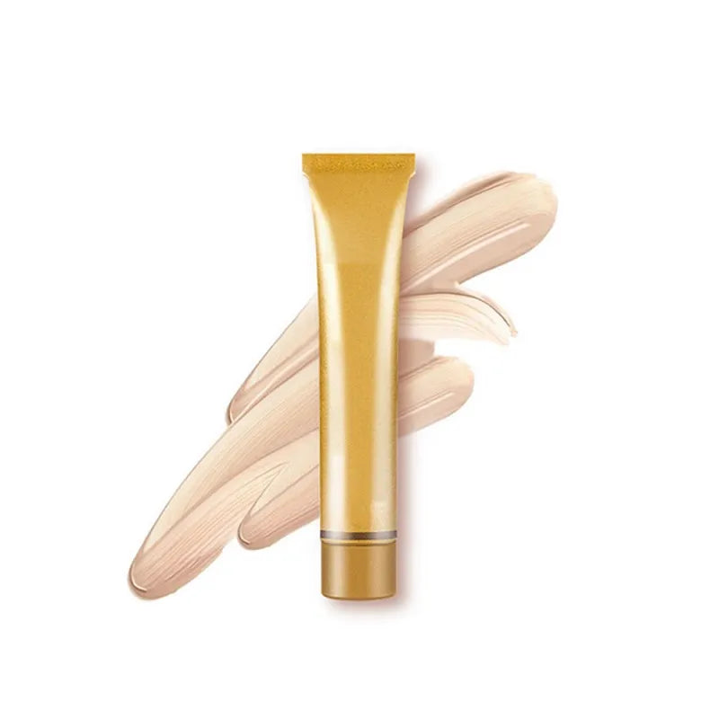 Gold tube of liquid concealer with applicator tip
