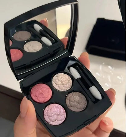 Four-color eyeshadow palette showing matte and shimmer shades