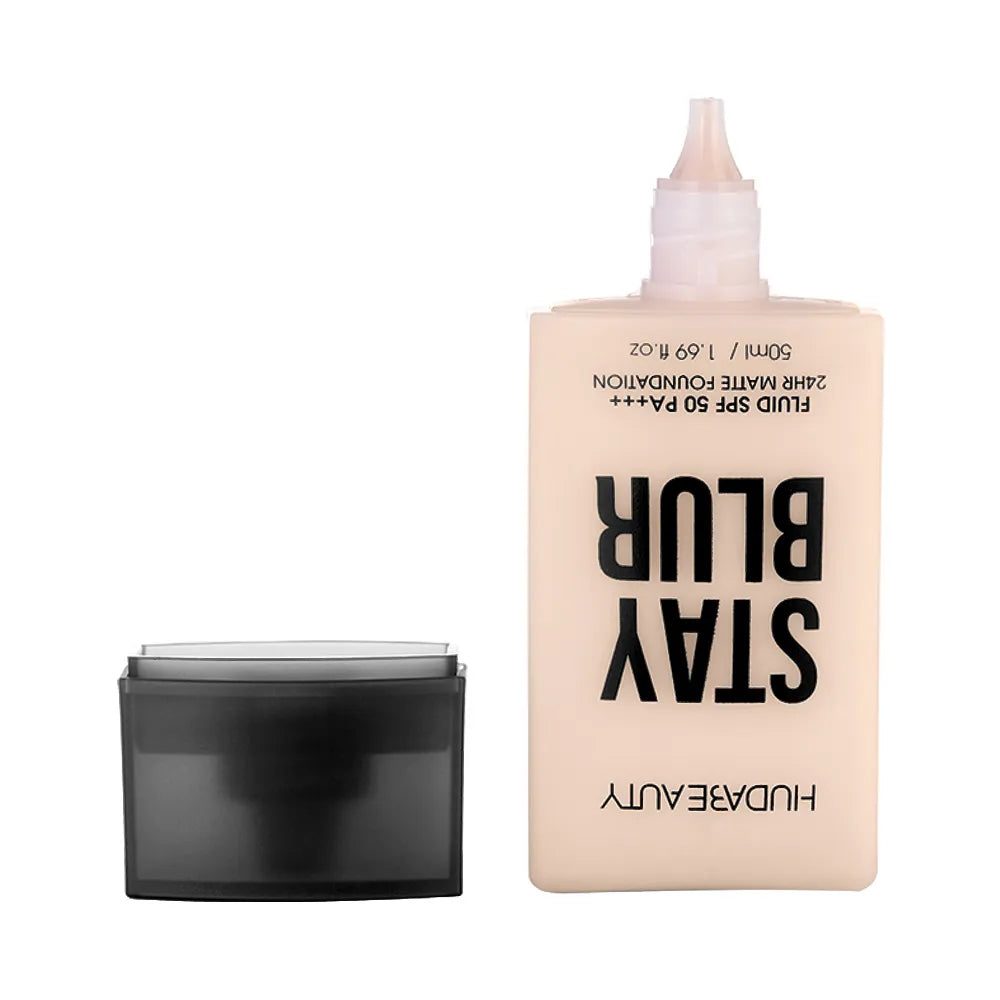 Liquid concealer product in clear bottle with applicator