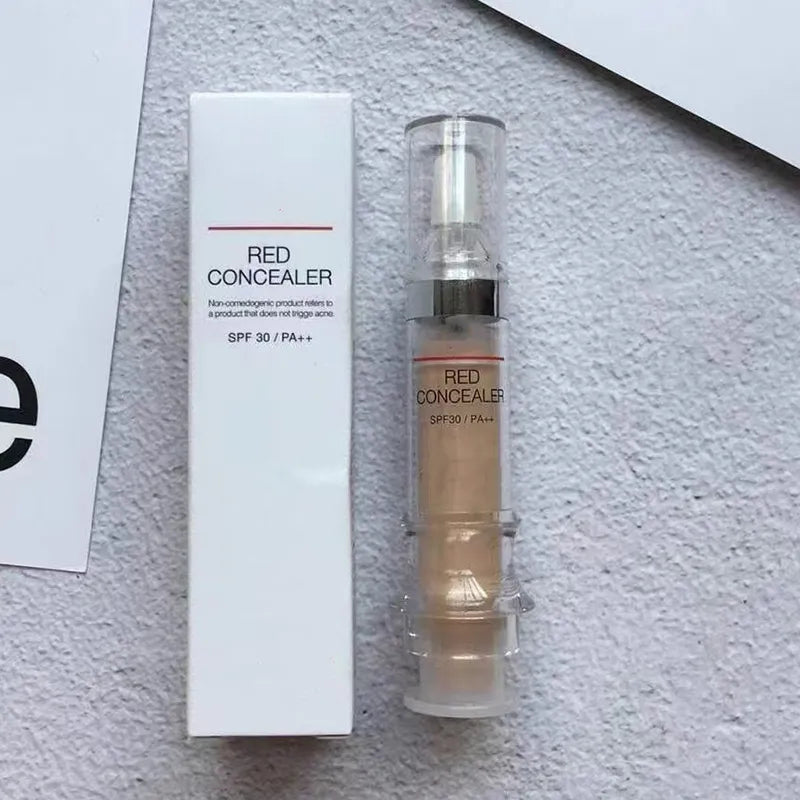 Liquid corrector product in spray bottle on neutral background