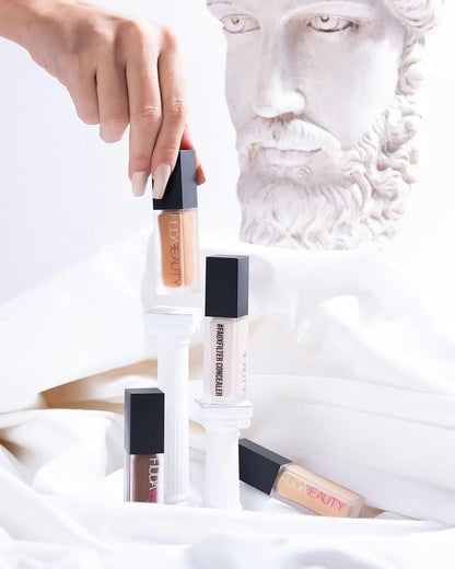 Liquid concealer product in clear container with applicator
