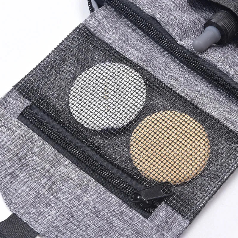 Folding cosmetic organizer with pendant handle in closed position