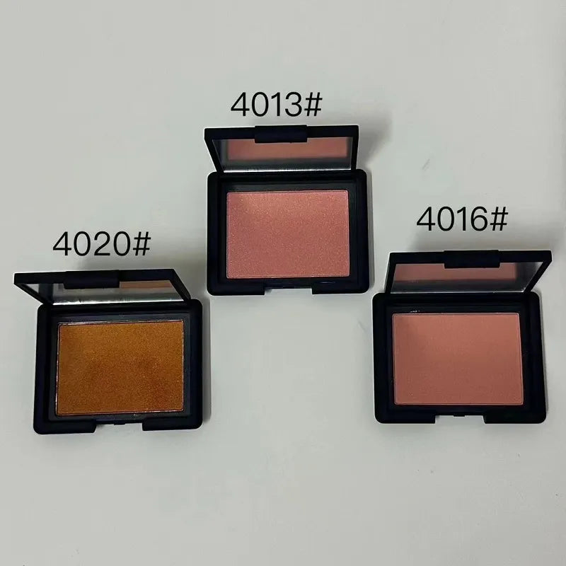 Open makeup palette showing three blush, bronzer, and highlighter shades