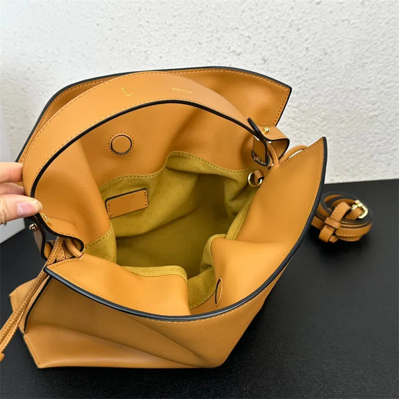 Model wearing the bag as a crossbody with strap attached