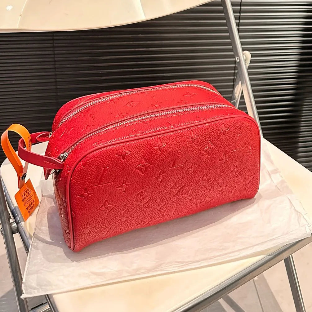 Open cosmetic bag showing interior organizer compartments