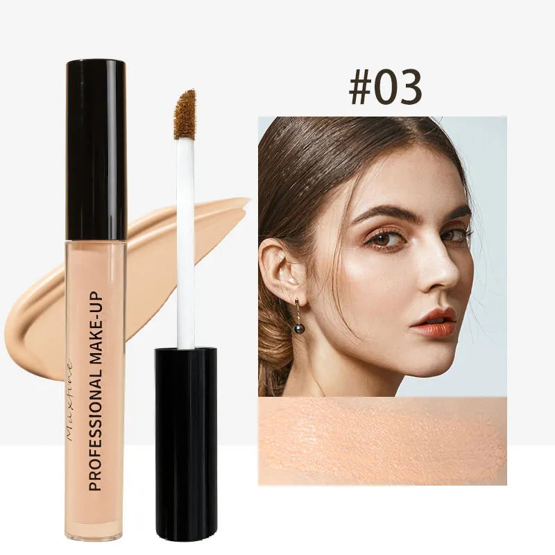 Close-up view of concealer being applied to skin with a brush applicator