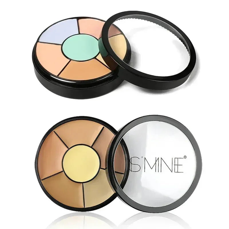 Open makeup palette showing multiple cream concealer shades arranged in circular pans