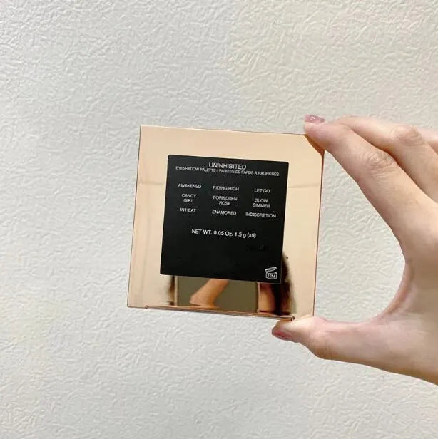 Front view of a 9-color eyeshadow palette with matte and shimmer shades