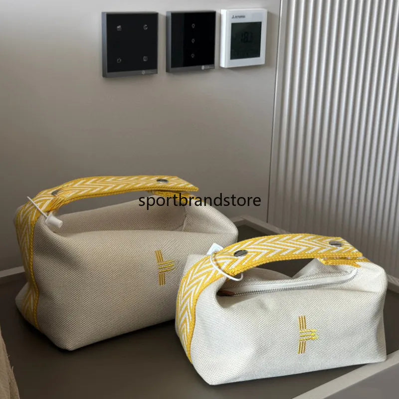 Vanity case being carried as crossbody bag with cosmetics visible