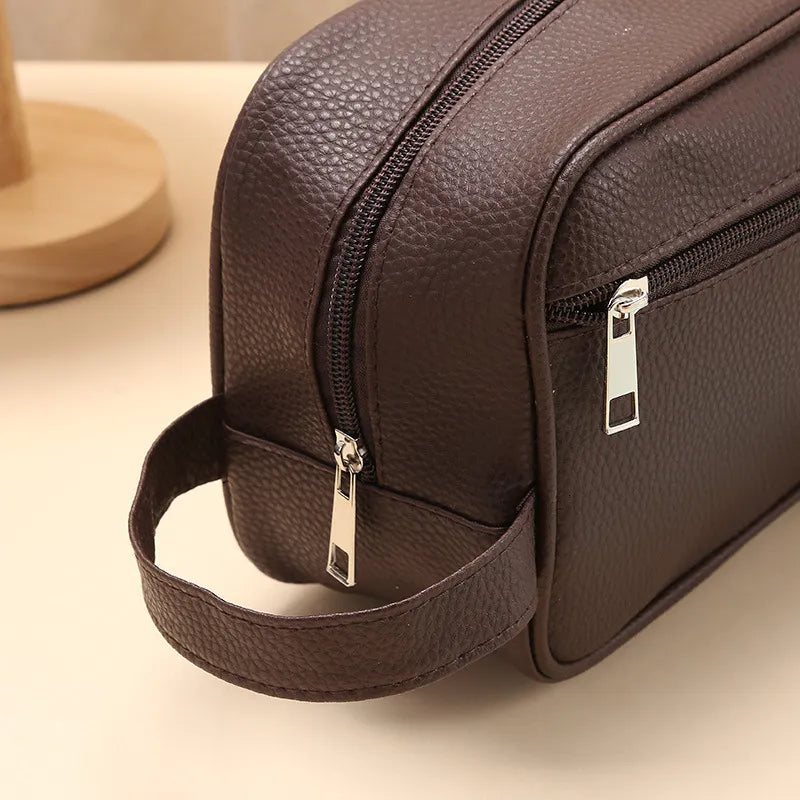Toiletry bag displayed with travel accessories for size reference